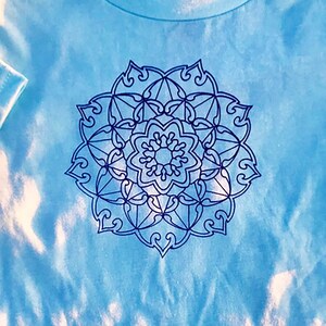 Mandala Children&#39;s T-Shirt in Purple on Light Blue