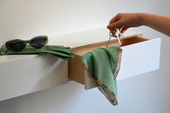 White floating entryway shelf / narrow entryway table with hidden drawers