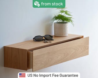 Floating entryway storage with a hidden drawer, made of solid oak