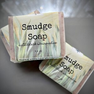 May include: Three bars of handmade soap with a white label that reads "Smudge Soap with Black Tourmaline 3.2 oz. Goat's milk and glycerin".