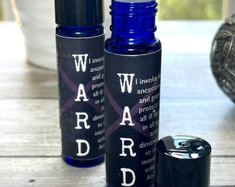 May include: Two blue glass roller bottles with black caps and labels. The labels have the word "WARD" in large white letters and text that reads "I invoke my ancestors and guardians to protect me from all ill spirits in all space and time. Dimensions to my intention unknown. And so it is."