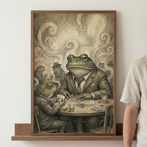 May include: A framed art print depicts anthropomorphic frogs playing poker. The frogs are dressed in suits and hats, seated around a table with cards and chips. The artwork is in sepia tones with swirling background details.