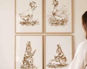 May include: Four framed sepia-toned prints featuring whimsical illustrations of animals. The prints depict a goose, a rabbit playing a cello, a goose in tall grass, and a rabbit watering plants. The frames are made of light-colored wood.