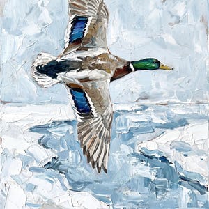 Textured winter mallard duck wall art flying over a snowy, icy lake with thick blue and white strokes.