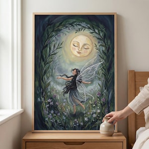 May include: A framed art print depicting a fairy dancing in a moonlit forest. The fairy has long black hair and translucent wings. The artwork is set in a wooden frame and shows a serene, dreamlike scene with soft colours. The print is in a wooden frame.