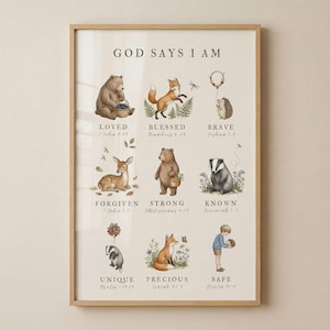 May include: A framed art print with the words "GOD SAYS I AM" at the top. The print features watercolor illustrations of animals, including a bear, fox, deer, and hedgehog, with inspirational words and Bible verses.