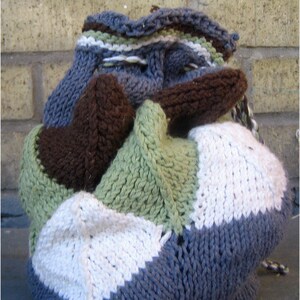 A drawstring bag made from different coloured mitered squares.  It has a twisted cord drawstring, and the top is edge with stripes.