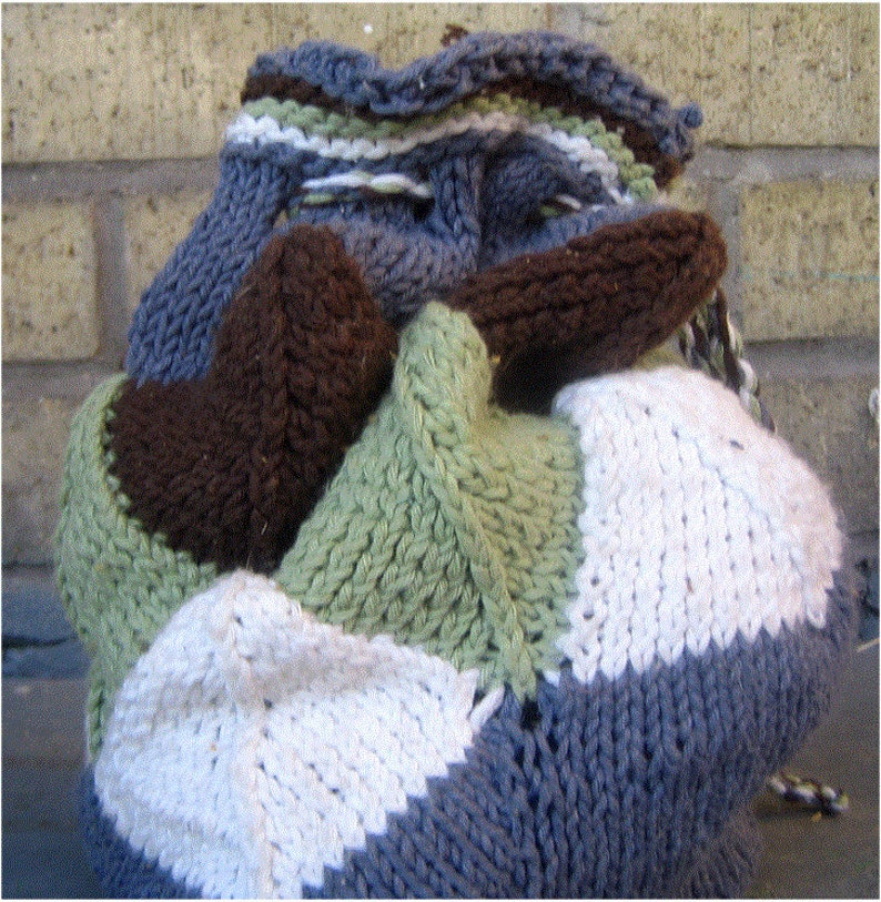 A drawstring bag made from different coloured mitered squares.  It has a twisted cord drawstring, and the top is edge with stripes.