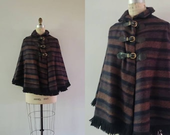 Vintage 1970s purple, grey and black striped wool poncho with leather buckle closure and fringe trim, 70s retro cape coat size small S