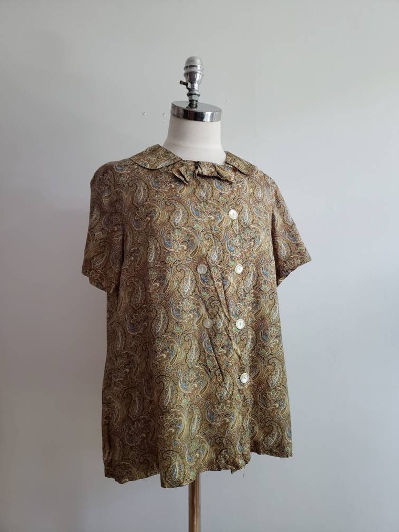 size mediumlarge ML 1970s paisley print button up short sleeve blouse with collar and bow Vintage 70s bohemian boho summer tent top