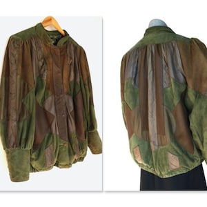 May include: A vintage patchwork jacket in green and brown hues. The jacket has a high collar, long sleeves with buttoned cuffs, and a gathered waist. The image shows both the front and back of the jacket, highlighting the distinctive design.