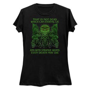 May include: Black t-shirt featuring a green and red graphic of a creature with text that reads "THAT IS NOT DEAD WHICH CAN ETERNAL LIE" and "AND WITH STRANGE AEONS EVEN DEATH MAY DIE".