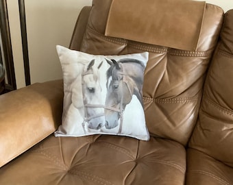 Accent pillow with image of horses.