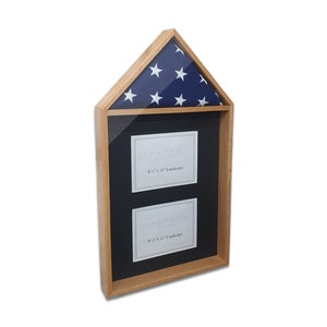 May include: A wooden shadow box with a glass front and a blue and white American flag on top. The box has two 8.5 x 11 inch landscape openings for displaying photos or documents.