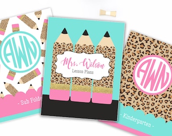 May include: Three rectangular folders featuring personalized designs. One has a white background with leopard print pencils and a teal monogram AWN. The center folder is teal with three leopard print pencils and the text Mrs. Wilson Lesson Plans. The third is leopard print with a pink monogram AWN and a teal scalloped edge labeled Kindergarten.