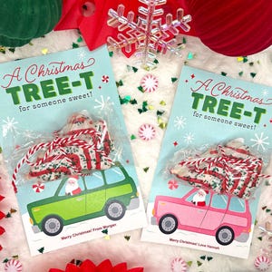 May include: Two Christmas treat bags with a tree-shaped cookie inside, tied with red and white twine. The bags are on cards with a green car illustration and the text "A Christmas TREE-T for someone sweet!" and "Merry Christmas!"