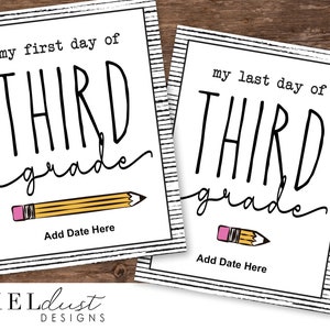May include: Two white rectangular signs with black text that read "my first day of THIRD grade" and "my last day of THIRD grade". Each sign has a pencil graphic and space to add a date. The signs have a black and white striped border.