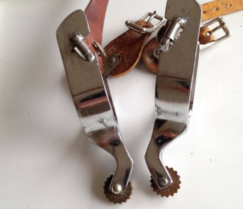 cowboy cowgirl rodeo Vintage heavy chrome over steel spurs with North /& Judd spur strap buckles shiny chrome in great shape brass rowels