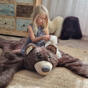 Mat, baby room carpet - bear skin. A soft brown fur rug. An addition to a room with a forest theme. Teddy bear motif