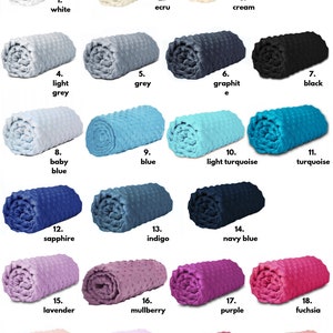 May include: A chart displaying 22 rolled-up fabric swatches in various colours. The colours include white, ecru, cream, light grey, grey, graphite, black, baby blue, blue, light turquoise, turquoise, sapphire, indigo, navy blue, lavender, mulberry, purple, fuchsia, powder pink, light pink, candy pink, and prism pink.