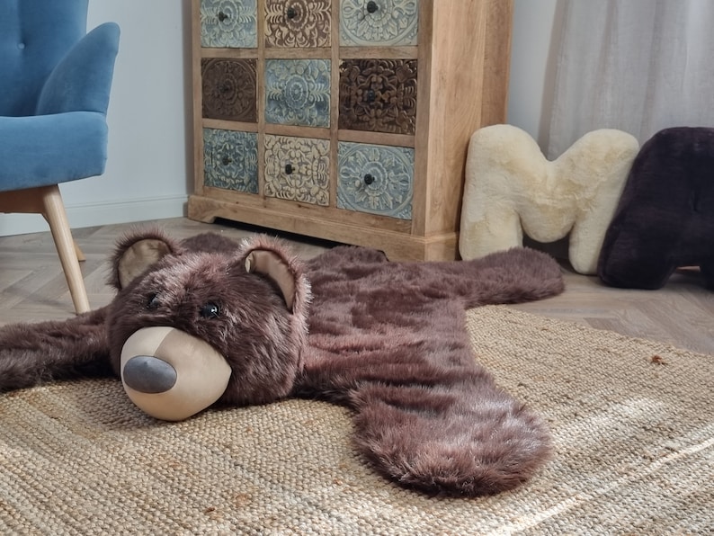 Mat, baby room carpet - bear skin. A soft brown fur rug. An addition to a room with a forest theme. Teddy bear motif
