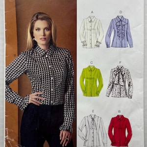 May include: Vogue Easy Options sewing pattern envelope VP937 for sizes 16-24. The front displays a black and white patterned long-sleeve button-down shirt and illustrations of six shirt variations labeled A through F in white, blue, green, and red.