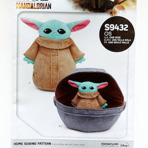 May include: A sewing pattern for a plush Grogu doll and a soft space pram from the Star Wars: The Mandalorian series. The pattern is from Simplicity and includes instructions for making a plush Grogu doll and a soft space pram. The pattern is for one size and is available in English, French, and Spanish.