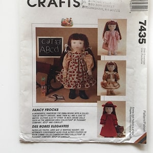 May include: A sewing pattern for making doll clothes. The pattern includes instructions for making dresses and a coat for an 18-inch doll. The pattern is called "Fancy Frocks" and is from McCall's Crafts.
