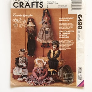 May include: A vintage McCall's Crafts sewing pattern for making Old McBungee Bells Farm characters. The pattern shows five different characters, including a pig, a cow, a horse, and a rooster. The pattern is for one envelope and includes instructions for making the characters.