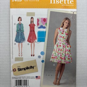 May include: A Lisette 1419 sewing pattern envelope by Simplicity featuring illustrations of two dresses and a photograph of a sleeveless, white-based dress with a pink and green floral print, a white collar, and a button-down front closure.