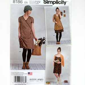 May include: Simplicity sewing pattern number 8186, size US 4, 6, 8, 10, 12, Euro 30-38, French 32-40, for a dress with a wrap style bodice and a skirt with a gathered hem. The pattern includes three different views: a dress with a short sleeve, a sleeveless dress, and a sleeveless dress with a cardigan. The pattern is designed by Dottie Angel.