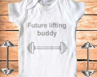 May include: White baby onesie with the text "Future lifting buddy" and a gray illustration of a barbell.