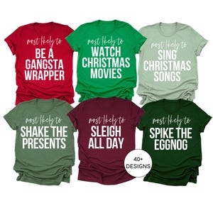 May include: Six Christmas-themed t-shirts with white text on different colored shirts. The shirts say "most likely to" followed by a Christmas-themed phrase. The phrases are "be a gangsta wrapper", "watch Christmas movies", "sing Christmas songs", "shake the presents", "sleigh all day", and "spike the eggnog".