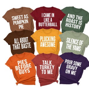 May include: A collection of nine short-sleeved t-shirts in various colors including brown, maroon, olive, mustard, orange, and purple. Each shirt features white text with phrases like Sweet as Pumpkin Pie, I Came in Like a Butterball, and Pies Before Guys.