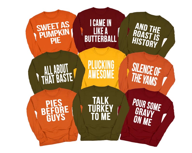 May include: A collection of nine long-sleeve crewneck sweatshirts in autumn colors including orange, maroon, olive green, and yellow. Each shirt features white text with phrases like Sweet as Pumpkin Pie, I Came in Like a Butterball, and Talk Turkey to Me.