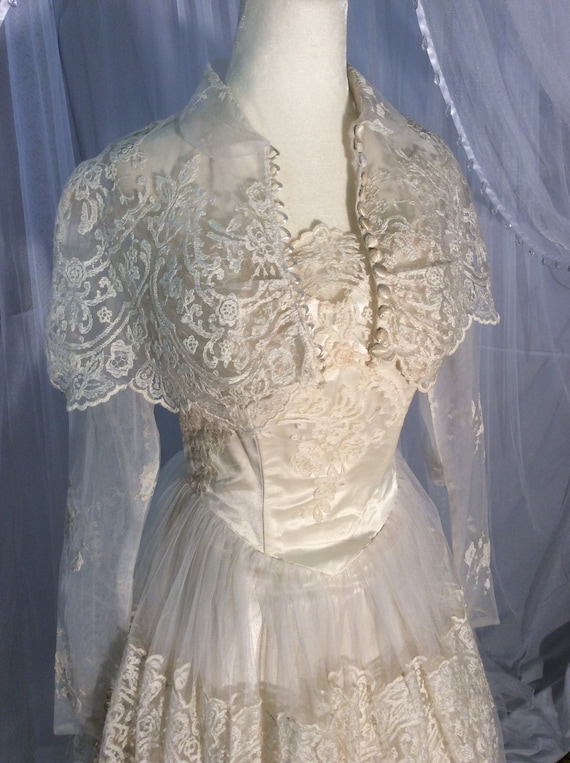 Vintage 1950’s lace and tulle wedding gown with bo