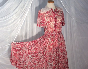 Vintage 1950’s adorable red floral full- skirted day dress with white eyelet collar.