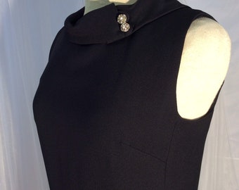 1960’s sleeveless black crepe cocktail sheath with rhinestone buttons by Westbury Fashions