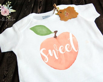 baby clothes with peaches
