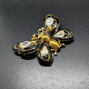 Trifari Gold Tone Clear Rhinestone Black Enamel Butterfly Brooch, signed.