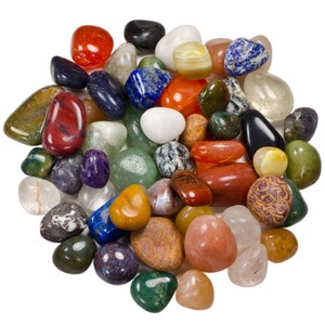 May include: A collection of colorful tumbled stones, including red, green, blue, yellow, and white. The stones are smooth and polished, and they are arranged in a pile on a white background.