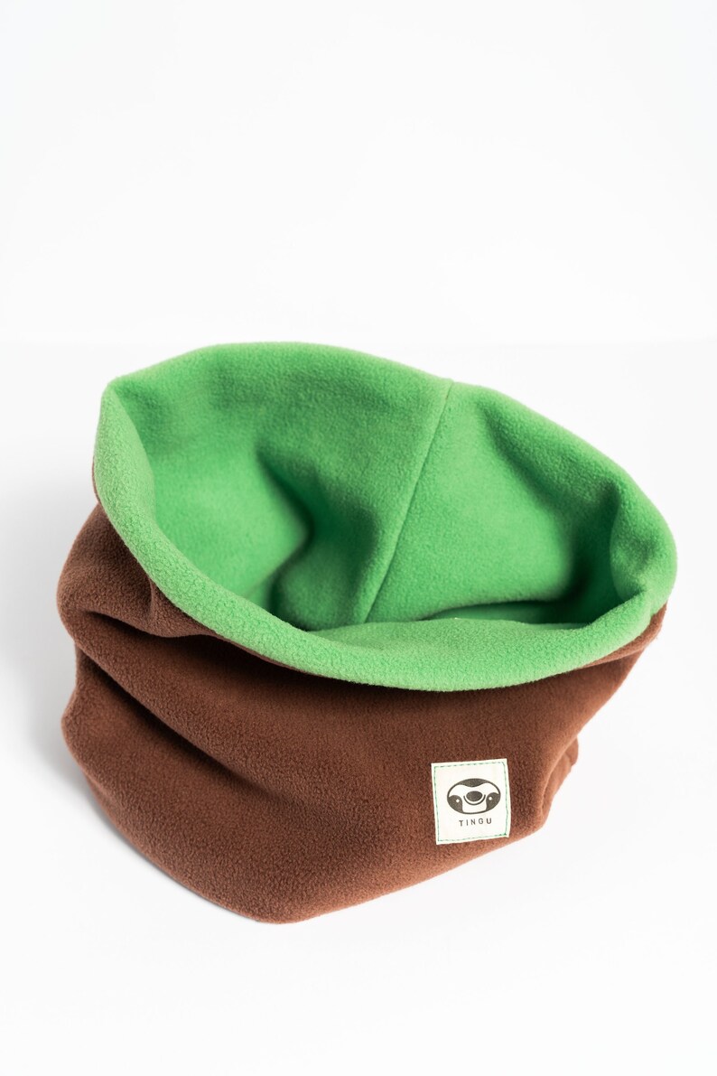 Versatile, double-layered neck warmer/snood in light green and brown.