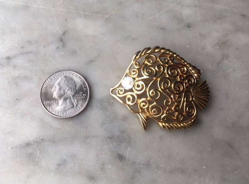 Vintage Trifari Figural Angel Fish Brooch Pin Gold Tone Rhinestone Eye Openwork Scroll Swirl Tropical Undersea Marine Animal Costume Jewelry