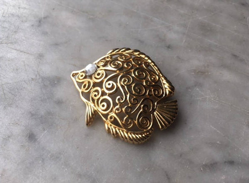 Vintage Trifari Figural Angel Fish Brooch Pin Gold Tone Rhinestone Eye Openwork Scroll Swirl Tropical Undersea Marine Animal Costume Jewelry