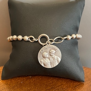 Old and rare silver pearl bracelet with medallion 1909