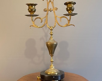 Old and rare religious altar candlestick with 2 arms in brass with a black marble stone XIXth century 36 cm