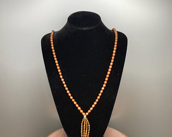 Antique and rare necklace of 5mm diameter orange cultured pearls, one strand of 98 pearls, magnetic metal clasp, 80cm