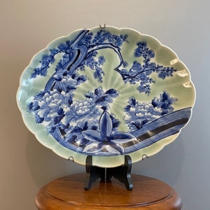 Old and rare oval dish in Chinese porcelain floral decoration in blue shades on a celadon background 20th century signed 33 cm