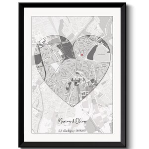 May include: A black and white map of a city with a red heart marking a location. The text "Marina & Oliver" and "We all began - 08.09.2007" is below the map.