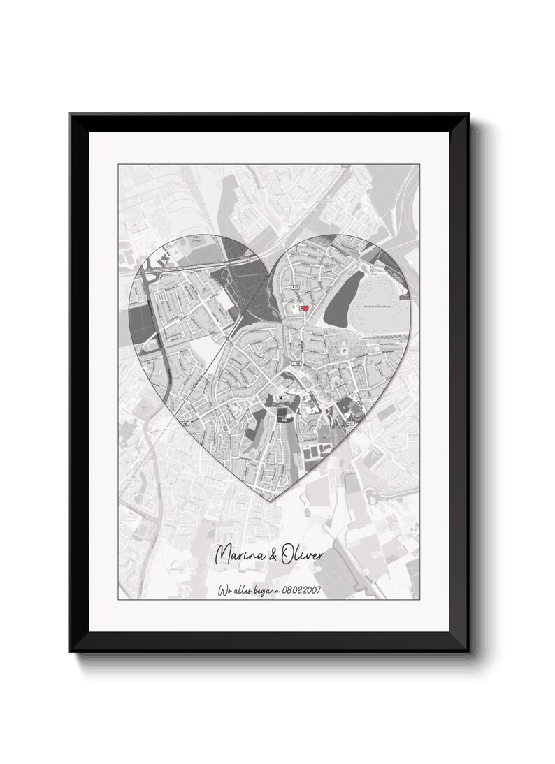 May include: A black and white map of a city with a red heart marking a location. The text "Marina & Oliver" and "We all began - 08.09.2007" is below the map.
